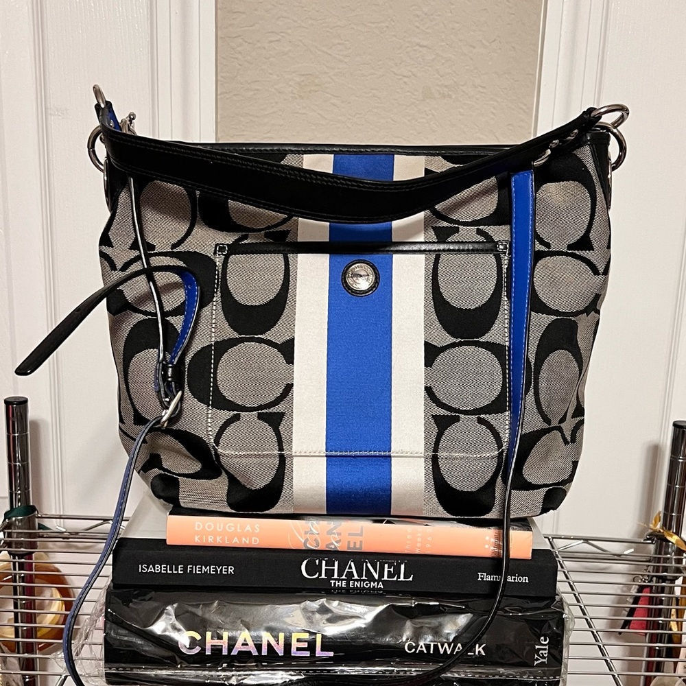 COACH Signature logo canvas shoulder bag with detachable long strap.